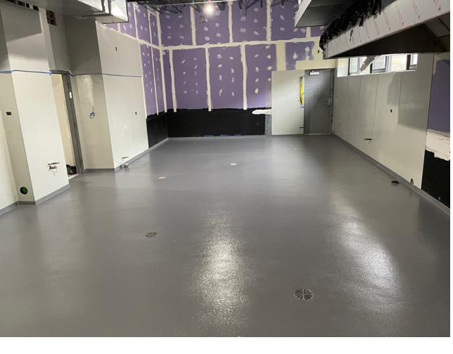 Full flake epoxy floor system in a light industrial building